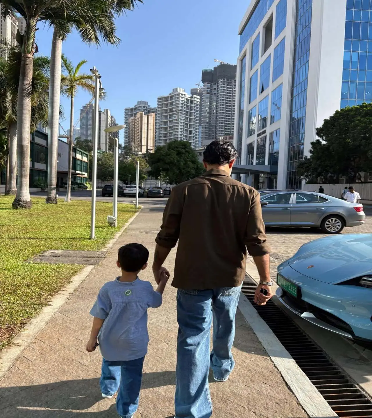Vayu and Anand are walking hand-in-hand on a street. Sonam simply captured her post: "Life is a dream.. this month so far.. thank you Universe. My three"